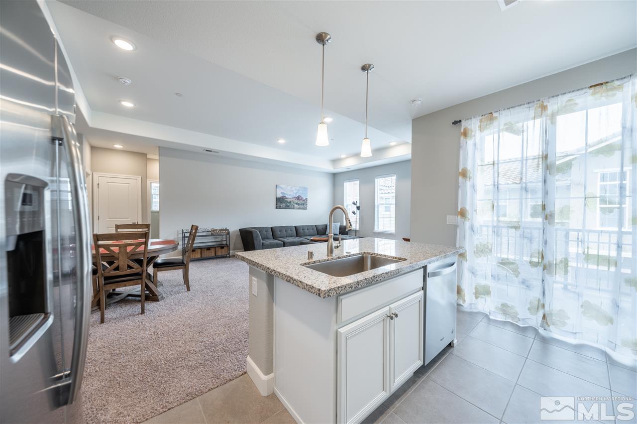 1852 Sea Horse Road, Unit A Reno, NV 89521 - Photo 8 of 21 a kitchen with sink stove and refrigerator