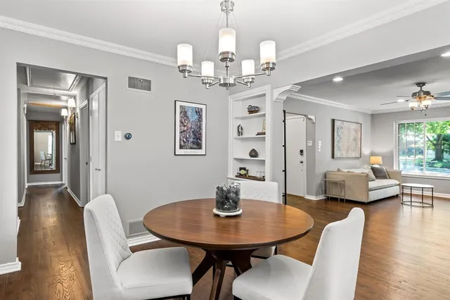 a kitchen with stainless steel appliances kitchen island a stove sink and cabinets