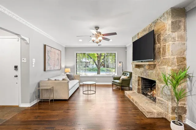 a living room with furniture fireplace and flat screen tv