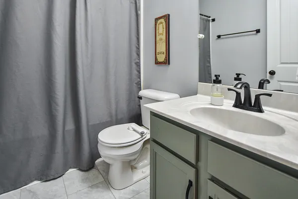a bathroom with a sink and a toilet