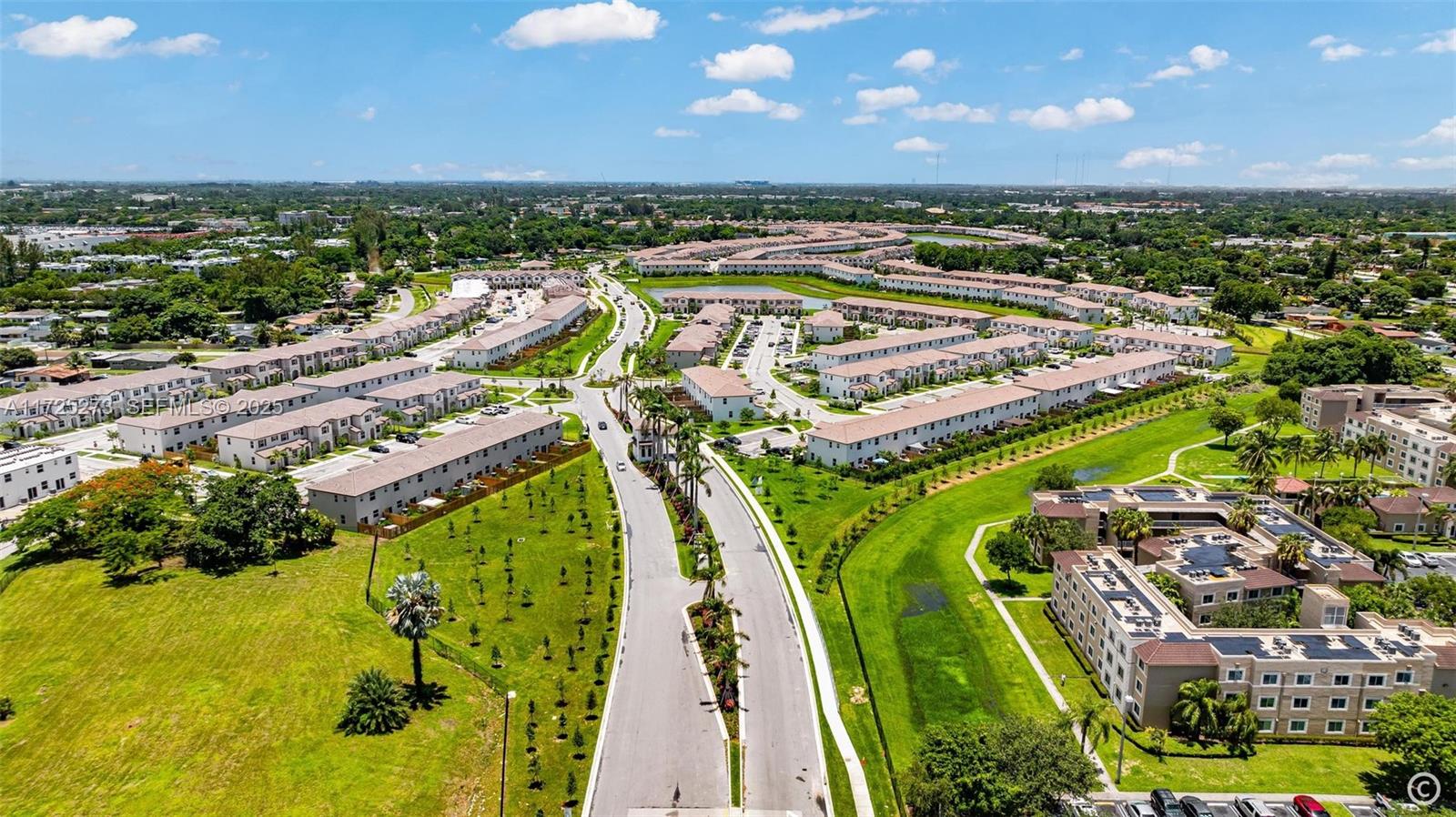 2357 Northwest 130th Street Miami, FL 33167 - Photo 16 of 48 a view of a swimming pool with a lot of trees in front