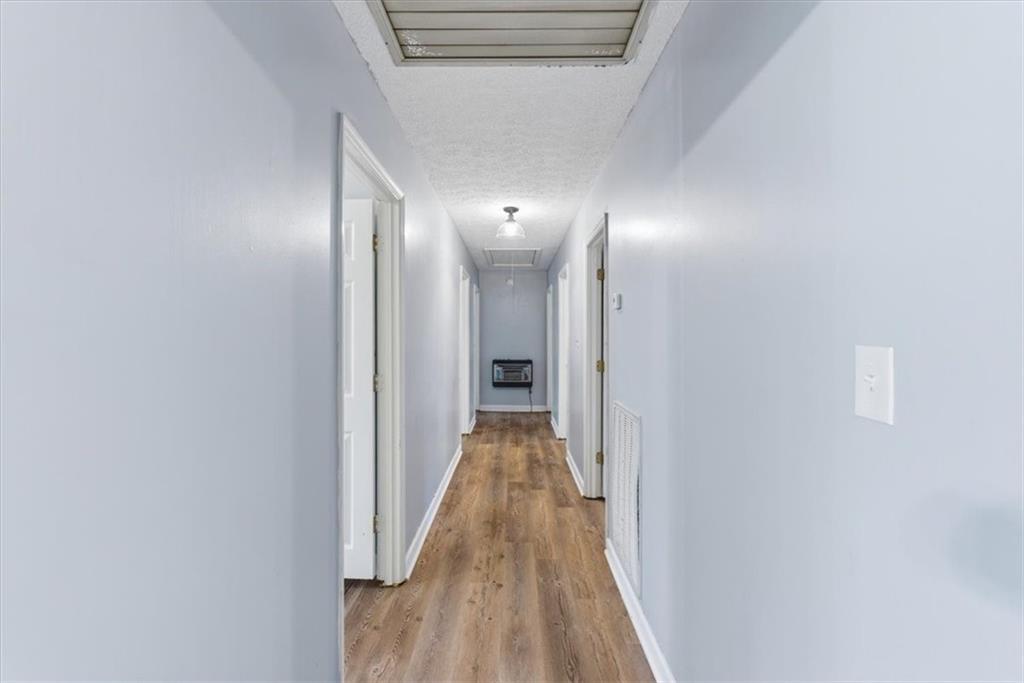 1500 Moores Ferry Road Southwest Plainville, GA 30733 - Photo 13 of 31 a view of a hallway with wooden floor