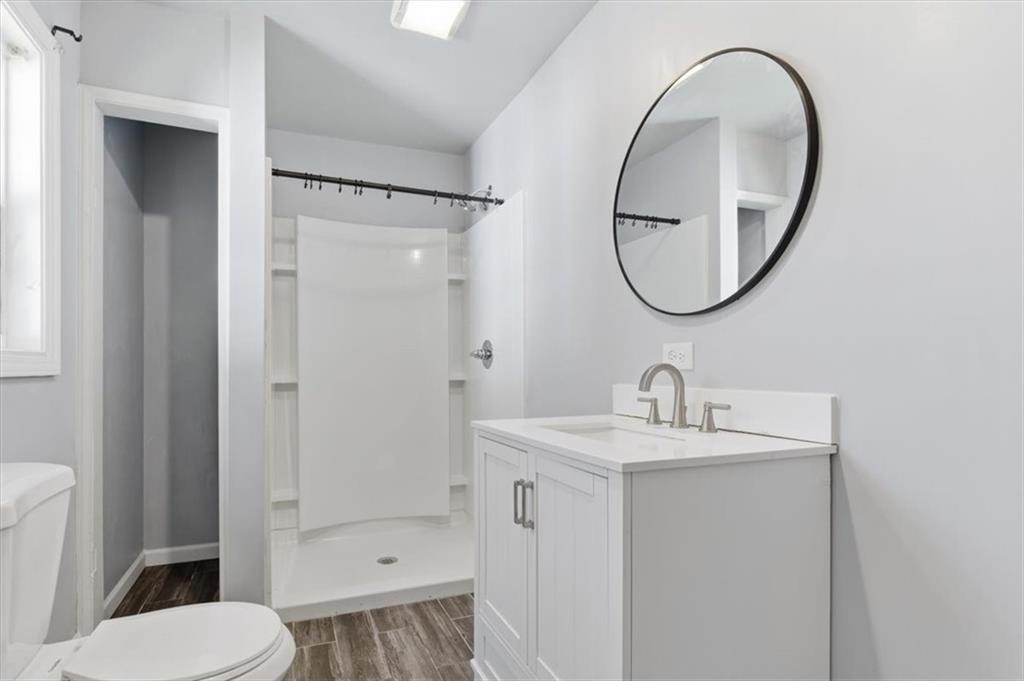 1500 Moores Ferry Road Southwest Plainville, GA 30733 - Photo 20 of 31 a bathroom with a sink a toilet and a mirror