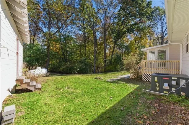 a house view with a sitting space and garden