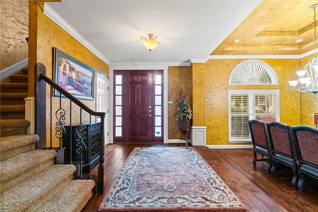 a view of a livingroom with furniture and workspace