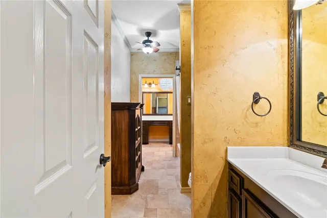 a bathroom with a sink vanity and a mirror