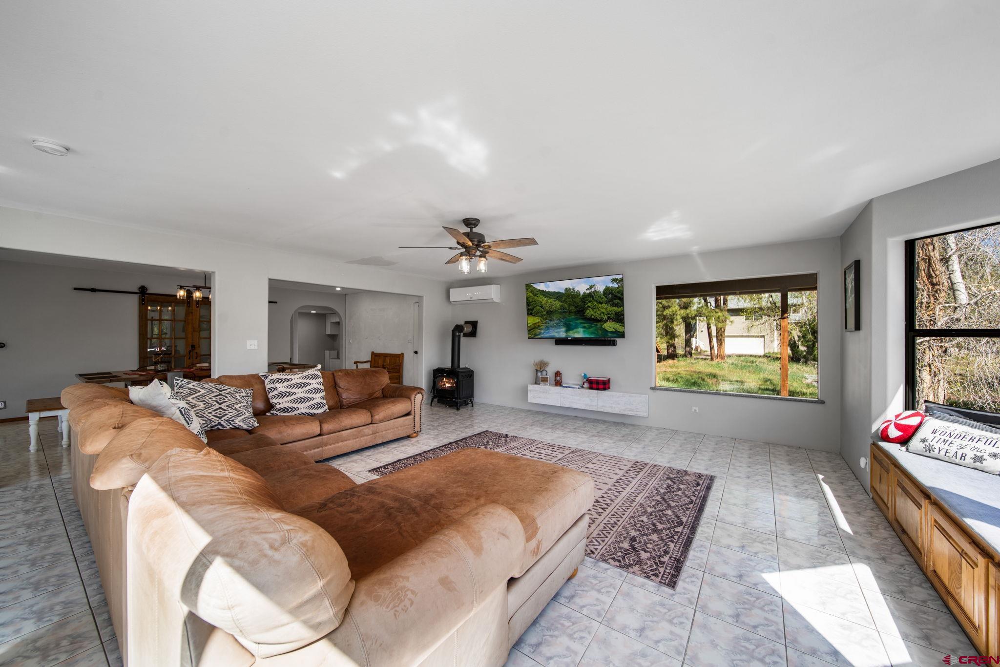 522 Pine River Ranch Circle Bayfield, CO 81122 - Photo 12 of 36 a living room with furniture fireplace and a window