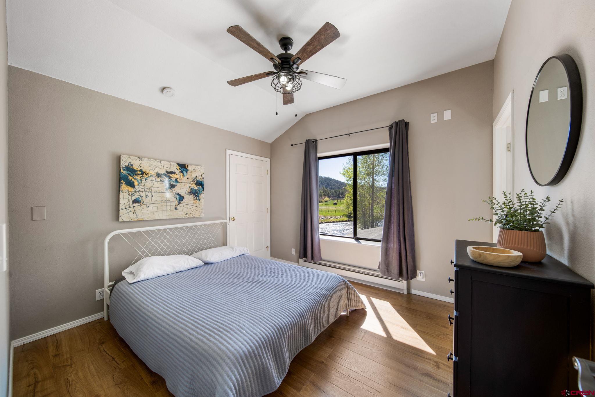 522 Pine River Ranch Circle Bayfield, CO 81122 - Photo 25 of 36 a bedroom with bed and window