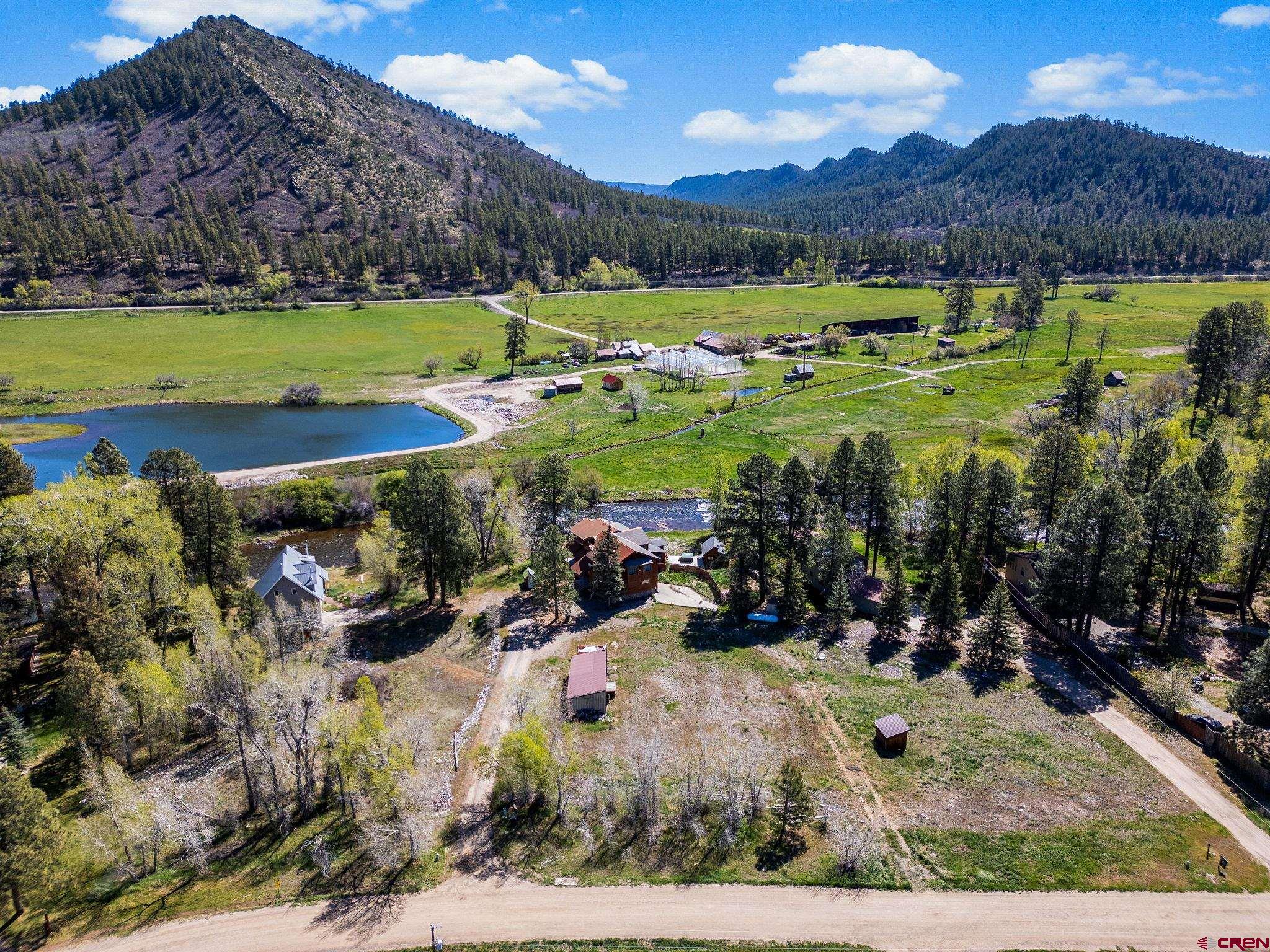 522 Pine River Ranch Circle Bayfield, CO 81122 - Photo 30 of 36 a view of a lake with a mountain