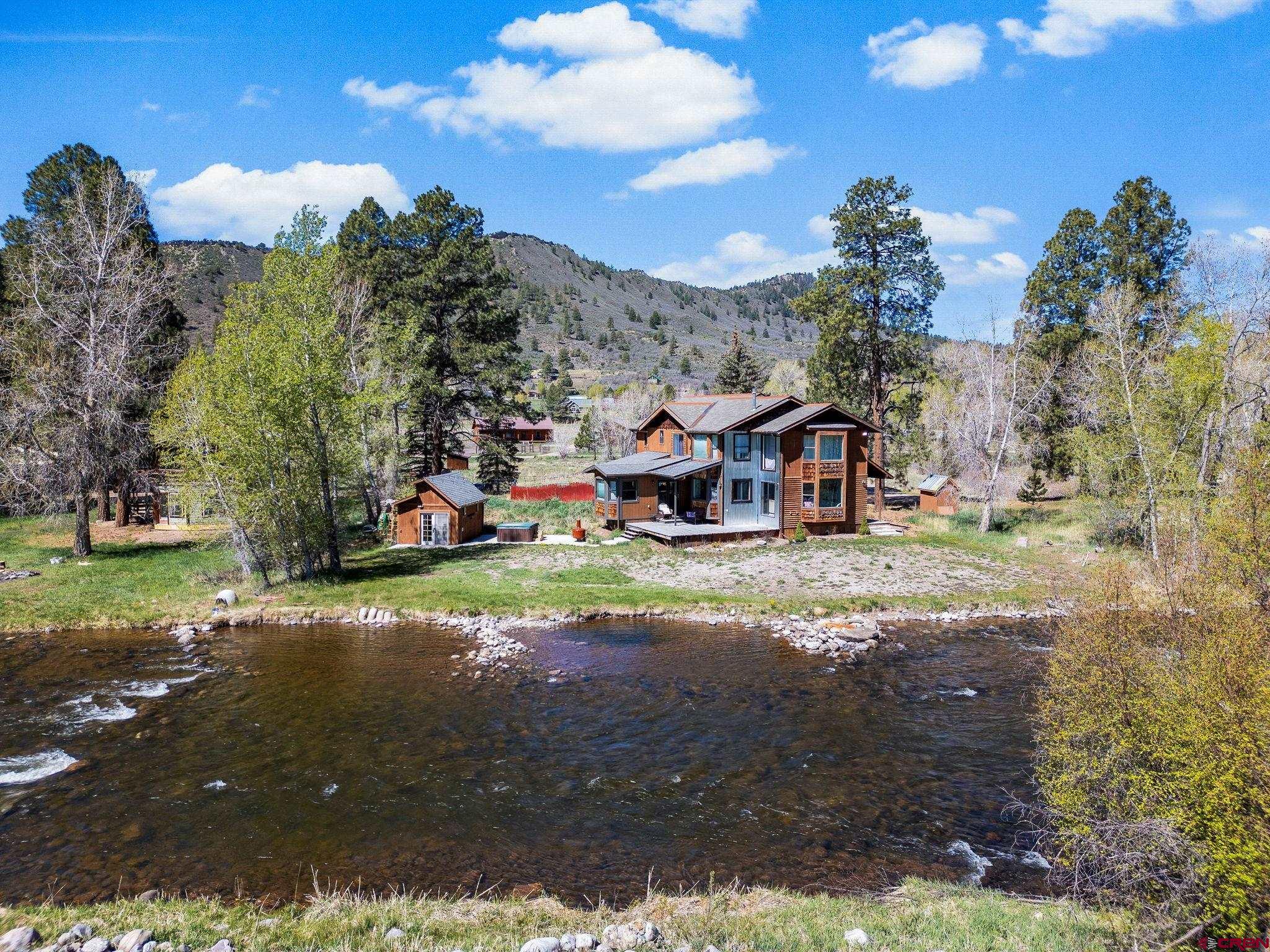 522 Pine River Ranch Circle Bayfield, CO 81122 - Photo 4 of 36 a view of a street with a house in the background
