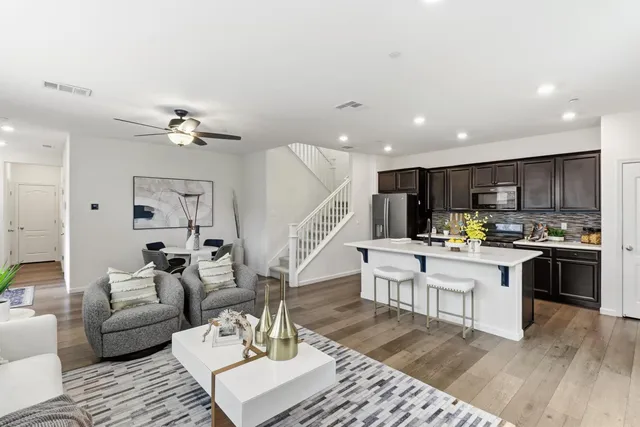 a view of a dining room with furniture and wooden floor