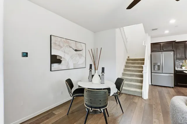 a view of a livingroom with furniture and a potted plant