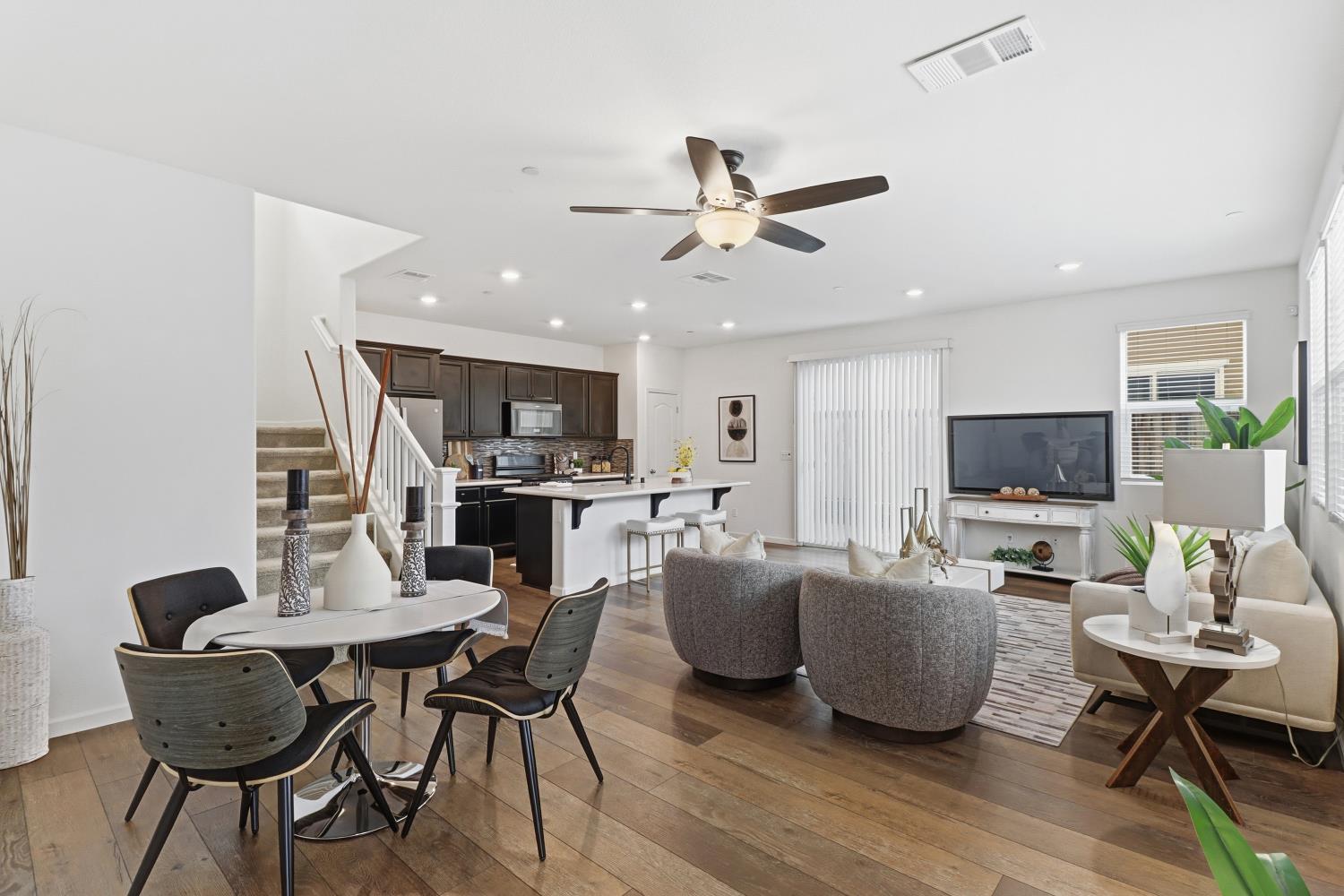 8900 Sheldon Terrace Lane Elk Grove, CA 95758 - Photo 14 of 57 a living room with furniture kitchen view and a flat screen tv