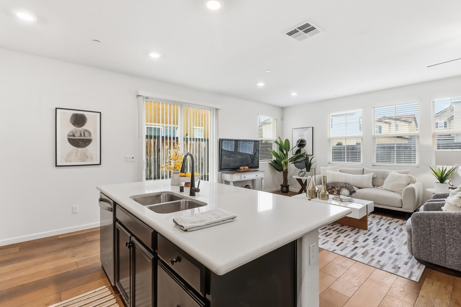 8900 Sheldon Terrace Lane Elk Grove, CA 95758 - Photo 21 of 57 a view of a dining room with furniture and wooden floor