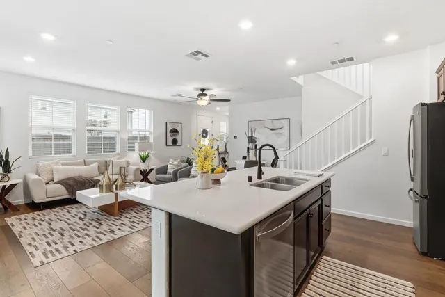 a kitchen that has a sink and a stove