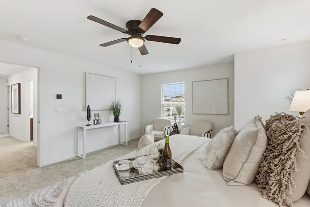 a spacious bathroom with a tub sink and mirror