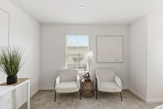 a bathroom with a granite countertop bathtub sink vanity mirror and toilet