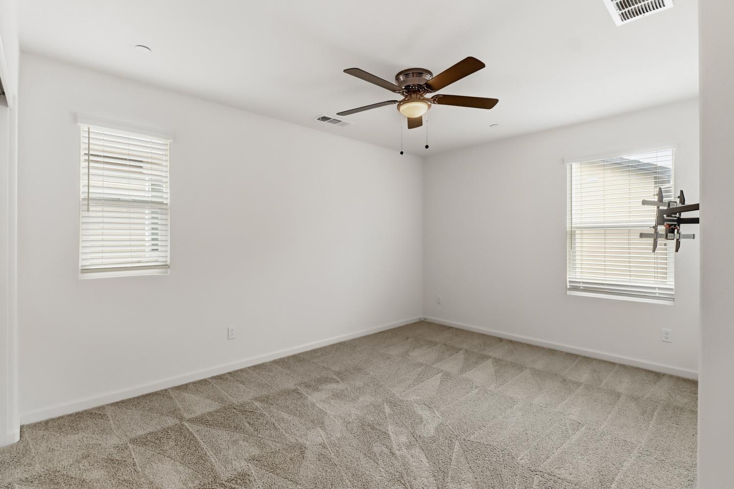 8900 Sheldon Terrace Lane Elk Grove, CA 95758 - Photo 42 of 57 a view of a big room with windows and chandelier fan