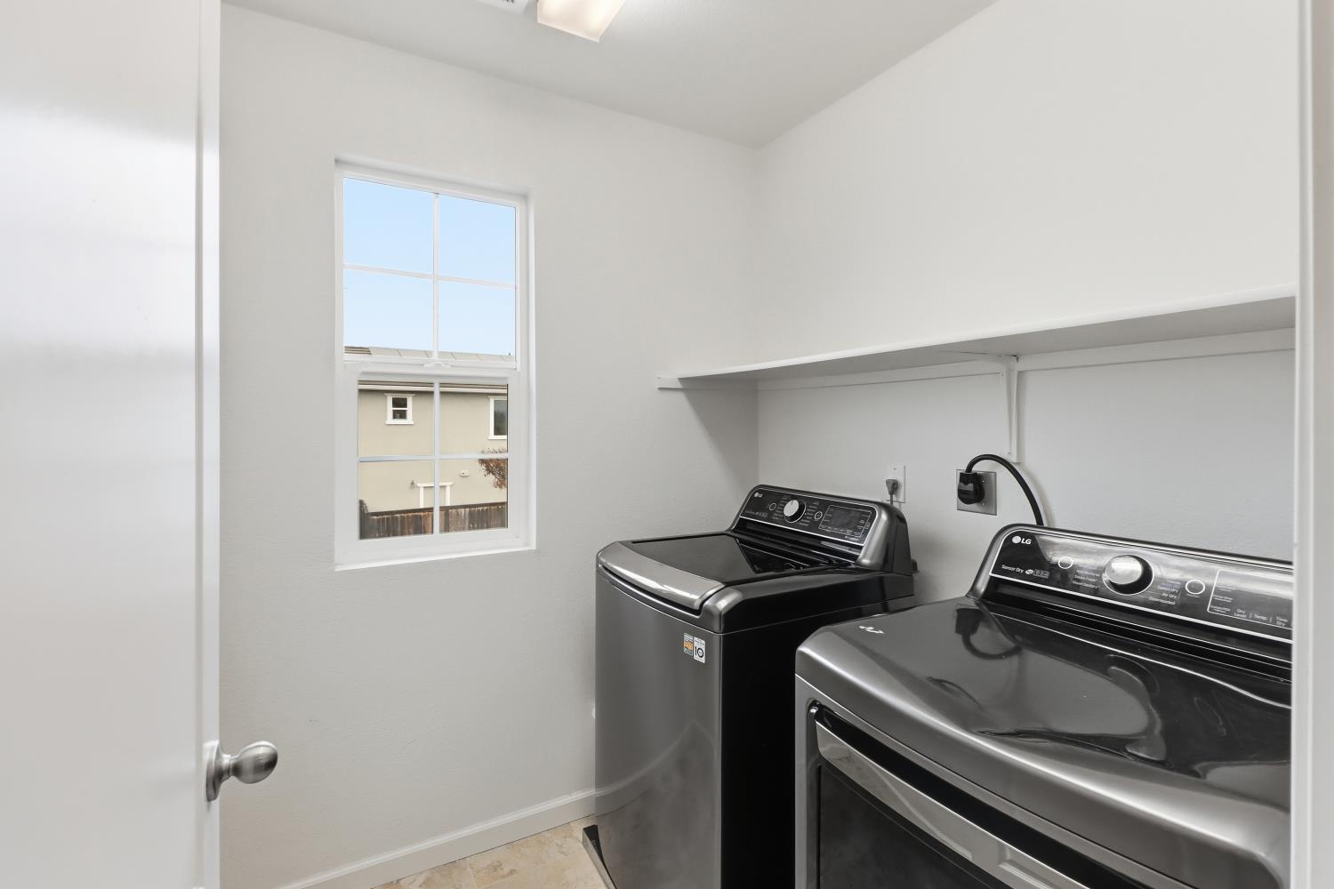 8900 Sheldon Terrace Lane Elk Grove, CA 95758 - Photo 44 of 57 a kitchen with a stove and a microwave