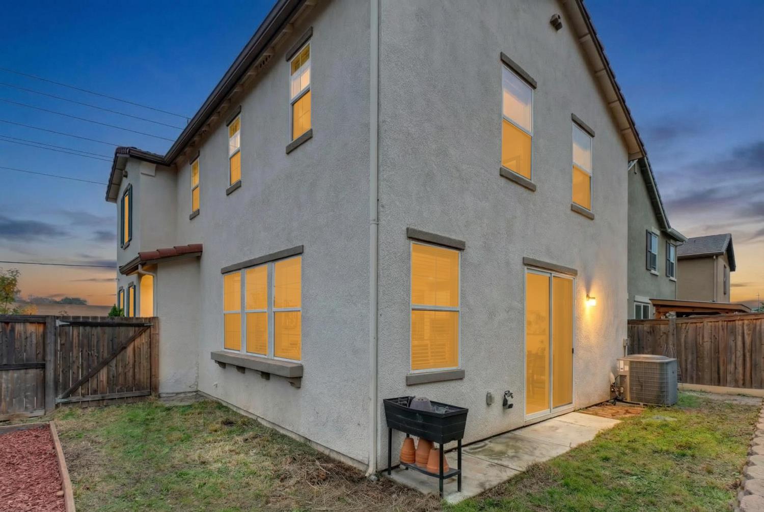8900 Sheldon Terrace Lane Elk Grove, CA 95758 - Photo 46 of 57 a backyard of a house with barbeque oven table and chairs