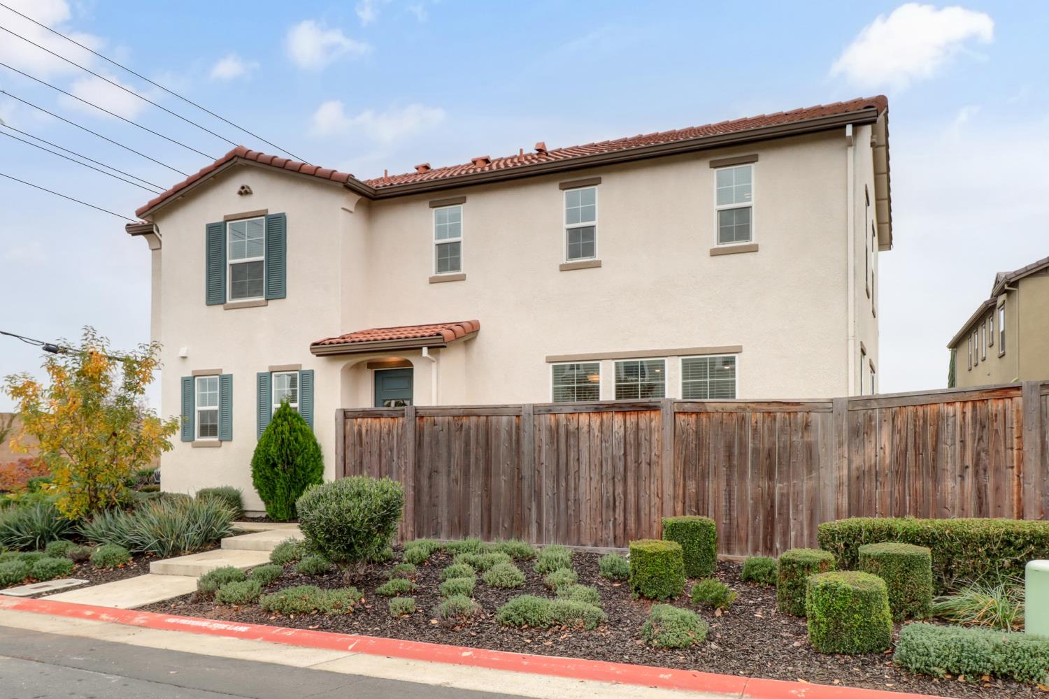 8900 Sheldon Terrace Lane Elk Grove, CA 95758 - Photo 49 of 57 a view of a house with wooden fence and potted plants