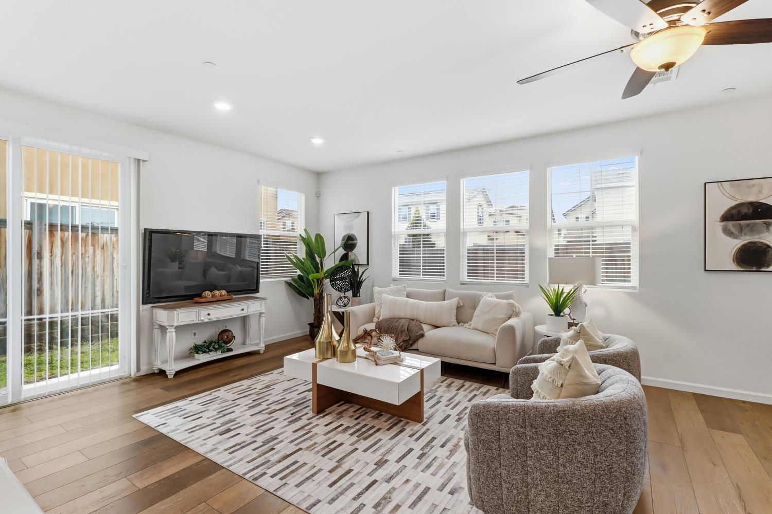 8900 Sheldon Terrace Lane Elk Grove, CA 95758 - Photo 9 of 57 a living room with furniture flat screen tv and a large window