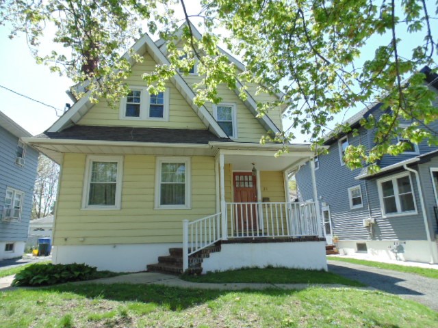 21 Monona Avenue Rutherford, NJ 07070 - Photo 1 of 1 a front view of a house with a yard
