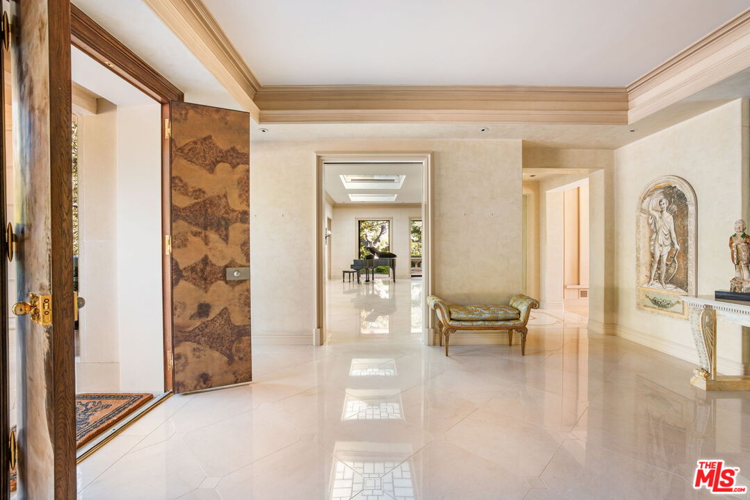 400 St Cloud Road Los Angeles, CA 90077 - Photo 11 of 25 a living room with furniture and a table