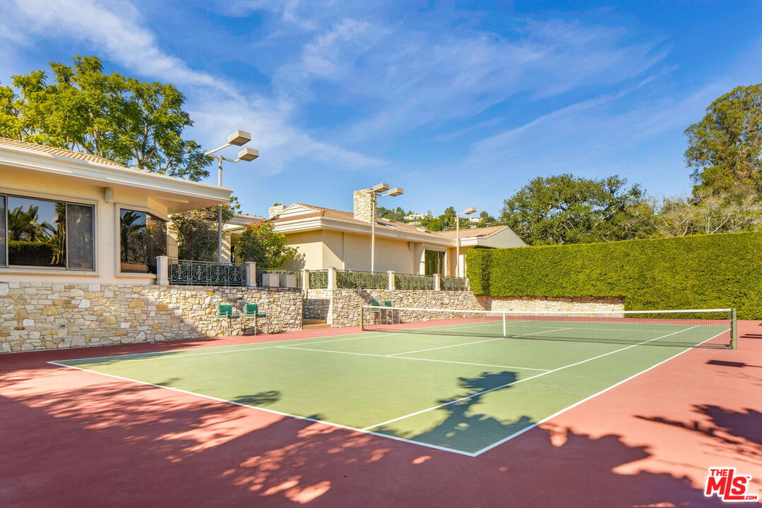 400 St Cloud Road Los Angeles, CA 90077 - Photo 4 of 25 a view of a house with a swimming pool