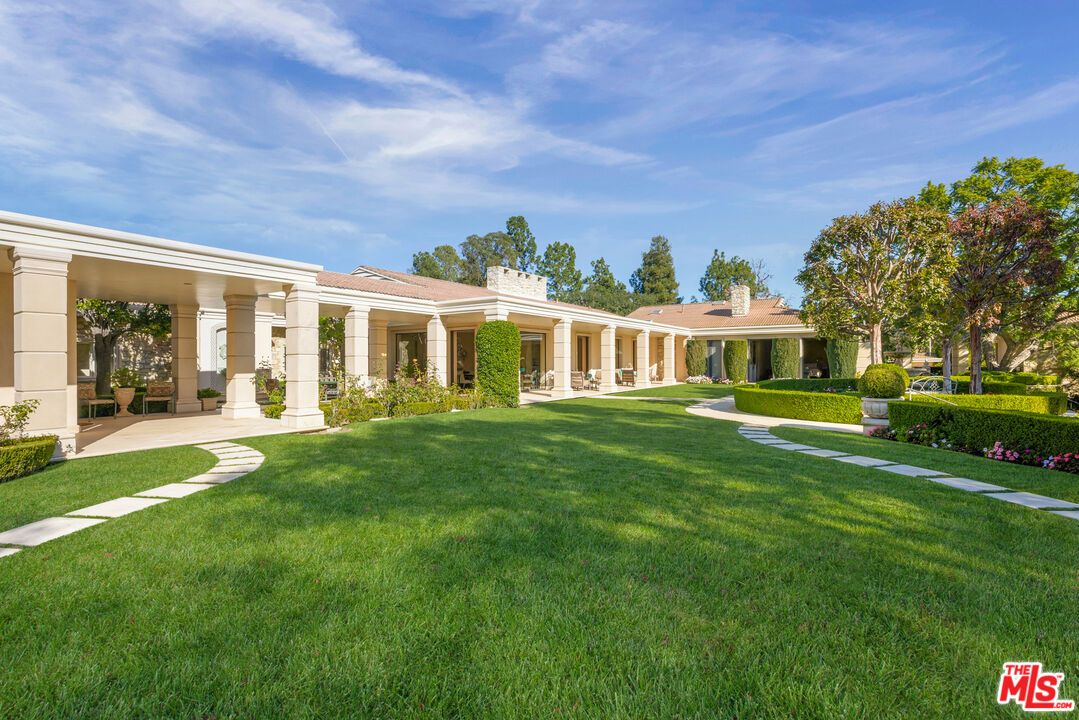 400 St Cloud Road Los Angeles, CA 90077 - Photo 10 of 25 a view of house with a big yard