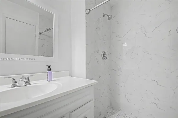 a bathroom with a sink and a mirror