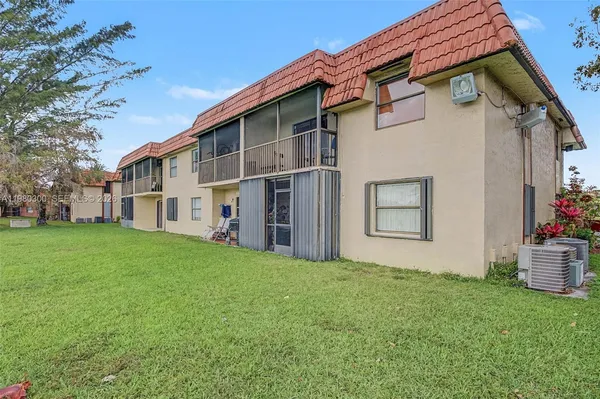 a view of a house with a back yard