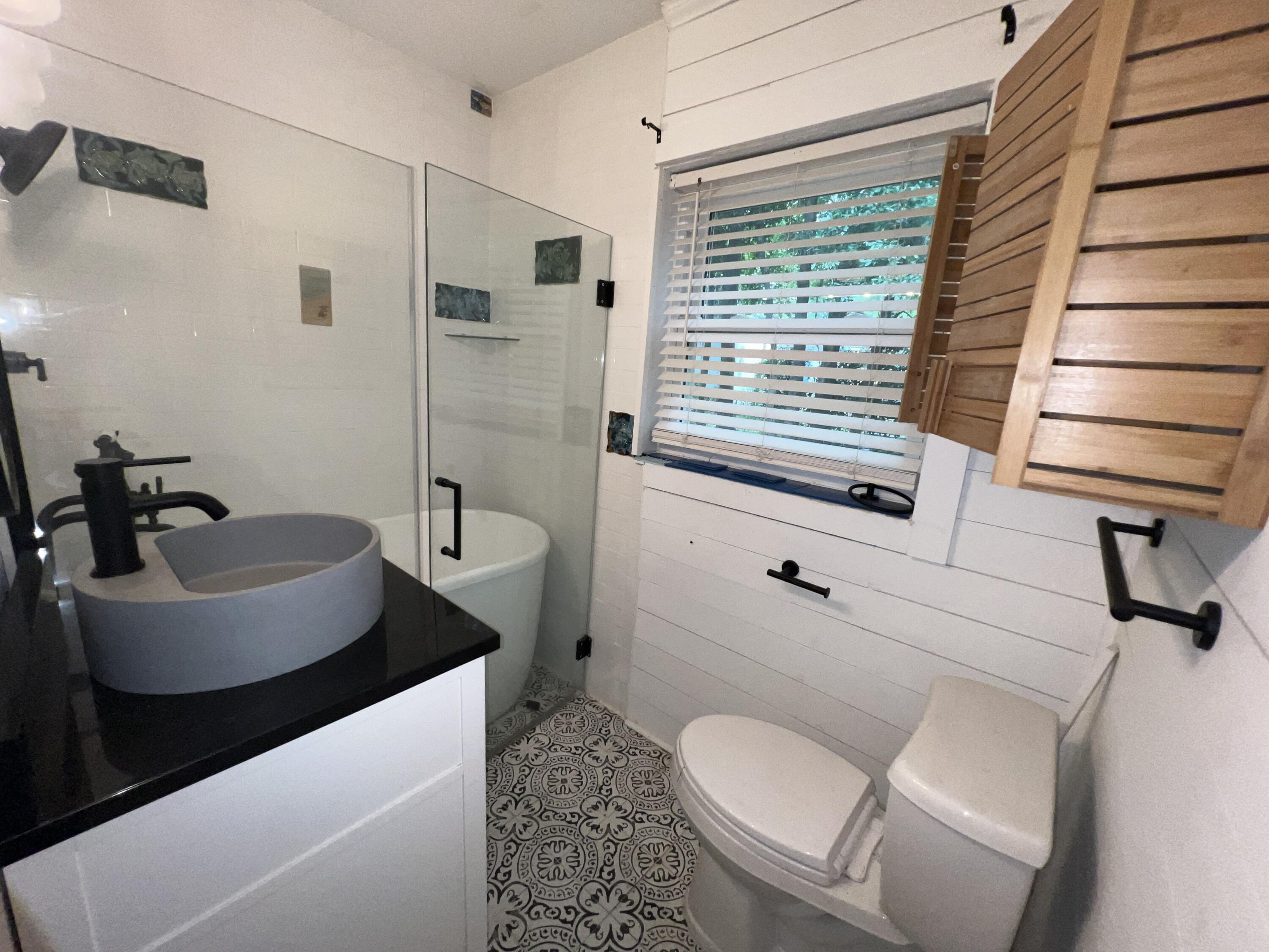 123 Panama Drive Crestview, FL 32536 - Photo 8 of 10 a bathroom with a sink toilet and shower