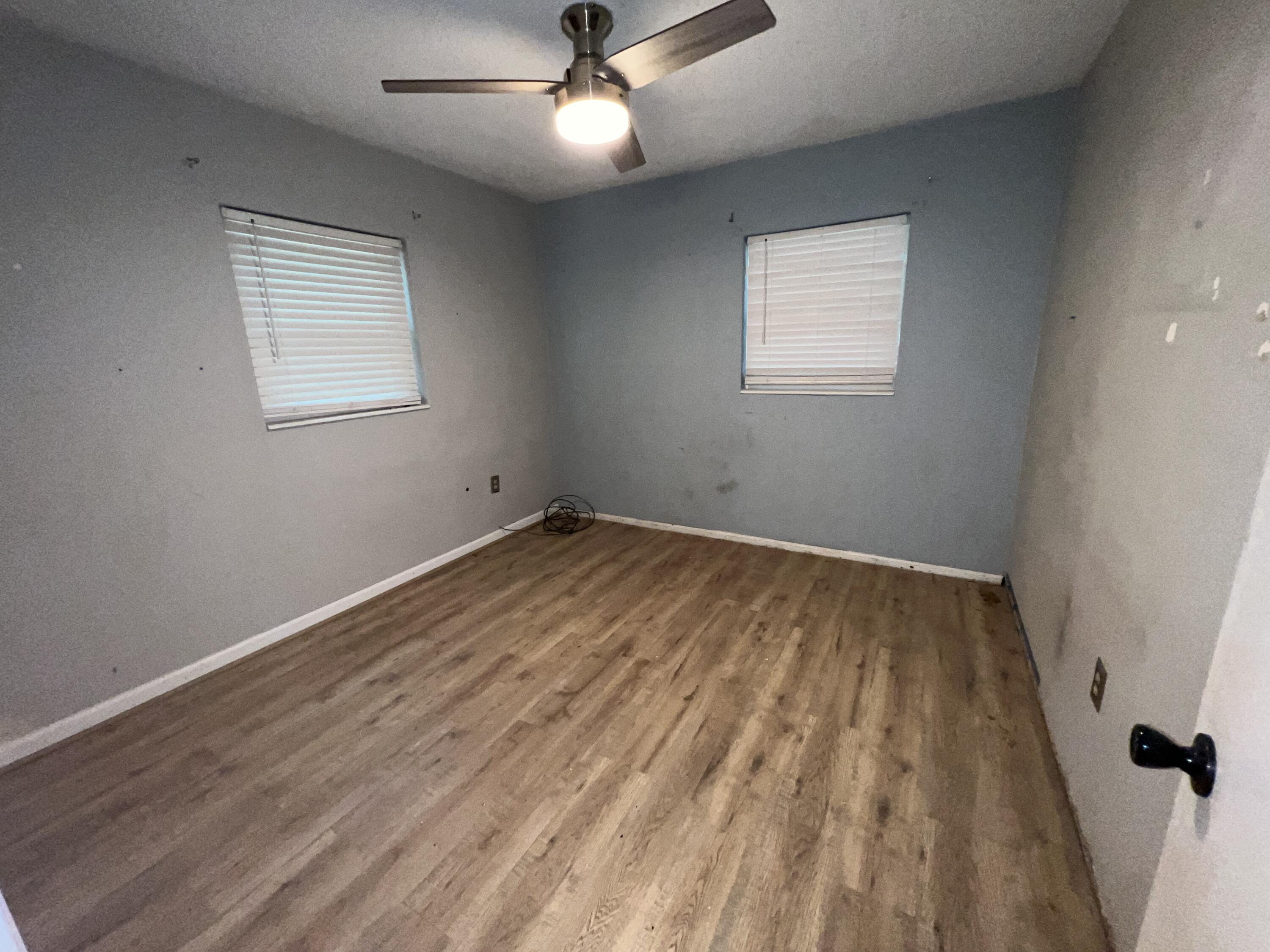 123 Panama Drive Crestview, FL 32536 - Photo 9 of 10 wooden floor in an empty room with a window