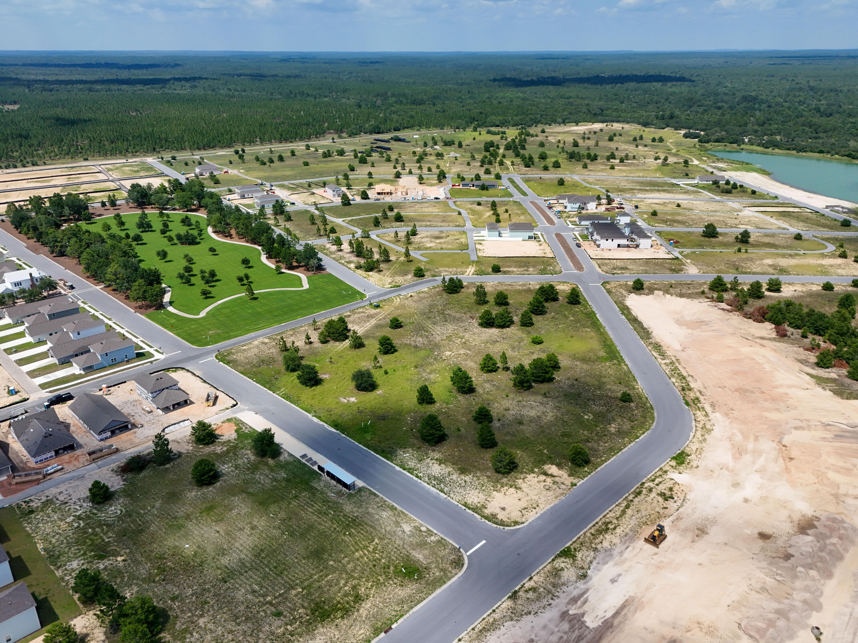 213 Huckleberry Street Freeport, FL 32439 - Photo 30 of 32 a view of a lake with a yard