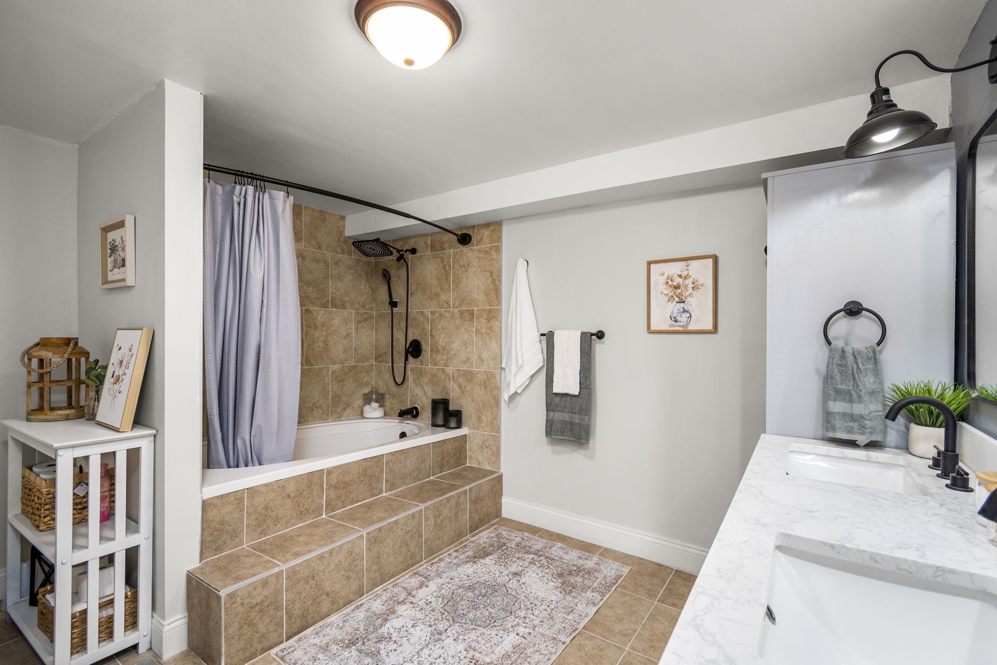 25311 Hardin Store Road Pinehurst, TX 77362 - Photo 15 of 39 a bathroom with a tub sink and mirror