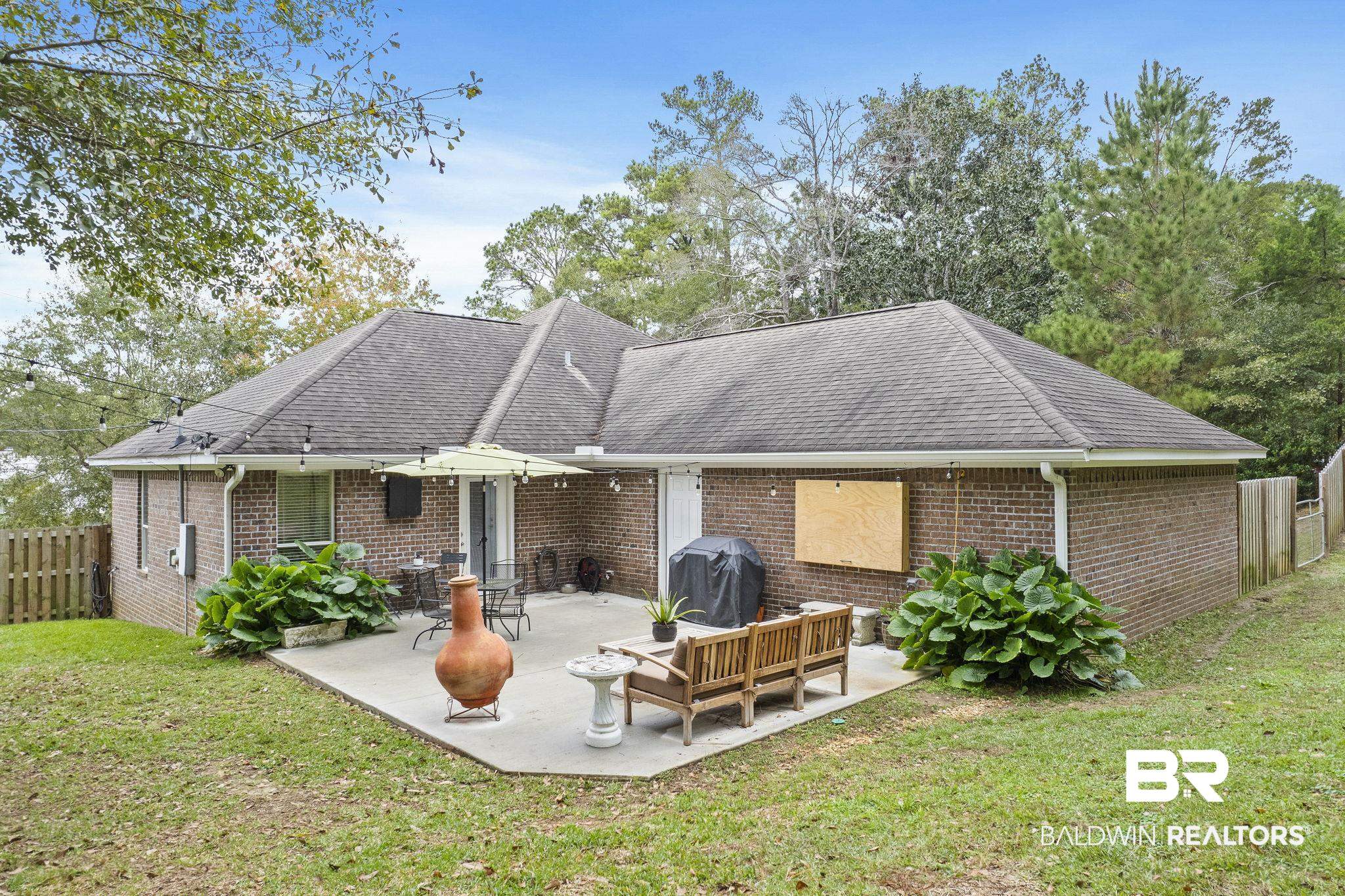 32072 Buzbee Road Daphne, AL 36527 - Photo 27 of 41 Rear view of property with a patio area and a yard