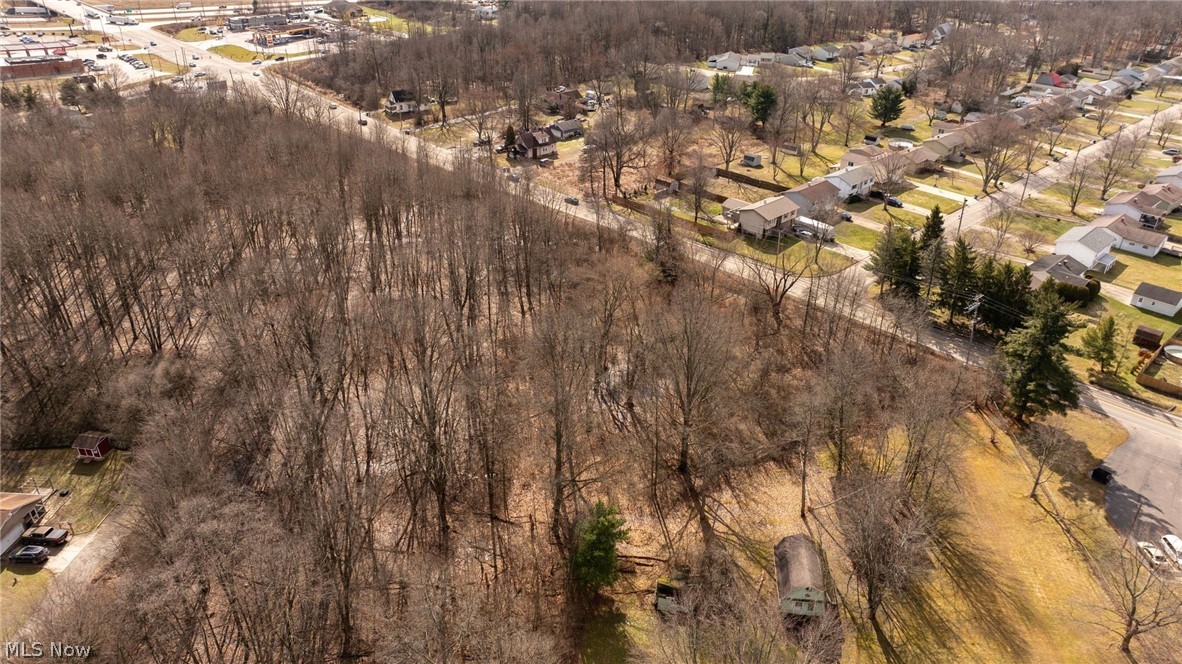 0 Salt Springs Road McDonald, OH 44437 - Photo 4 of 13 Aerial view of property and surrounding area with nearby suburban area