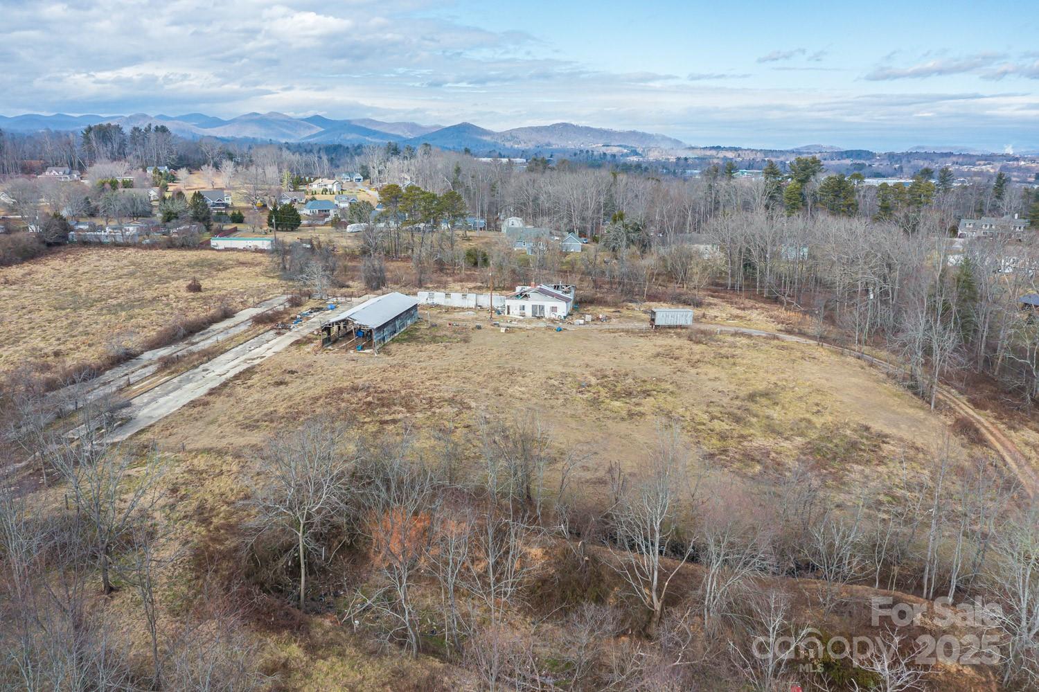 0 Ladson Road Horse Shoe, NC 28742 - Photo 7 of 11 a view of a dry yard with wooden fence