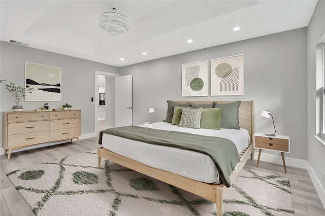 a bedroom with a bed and a chair