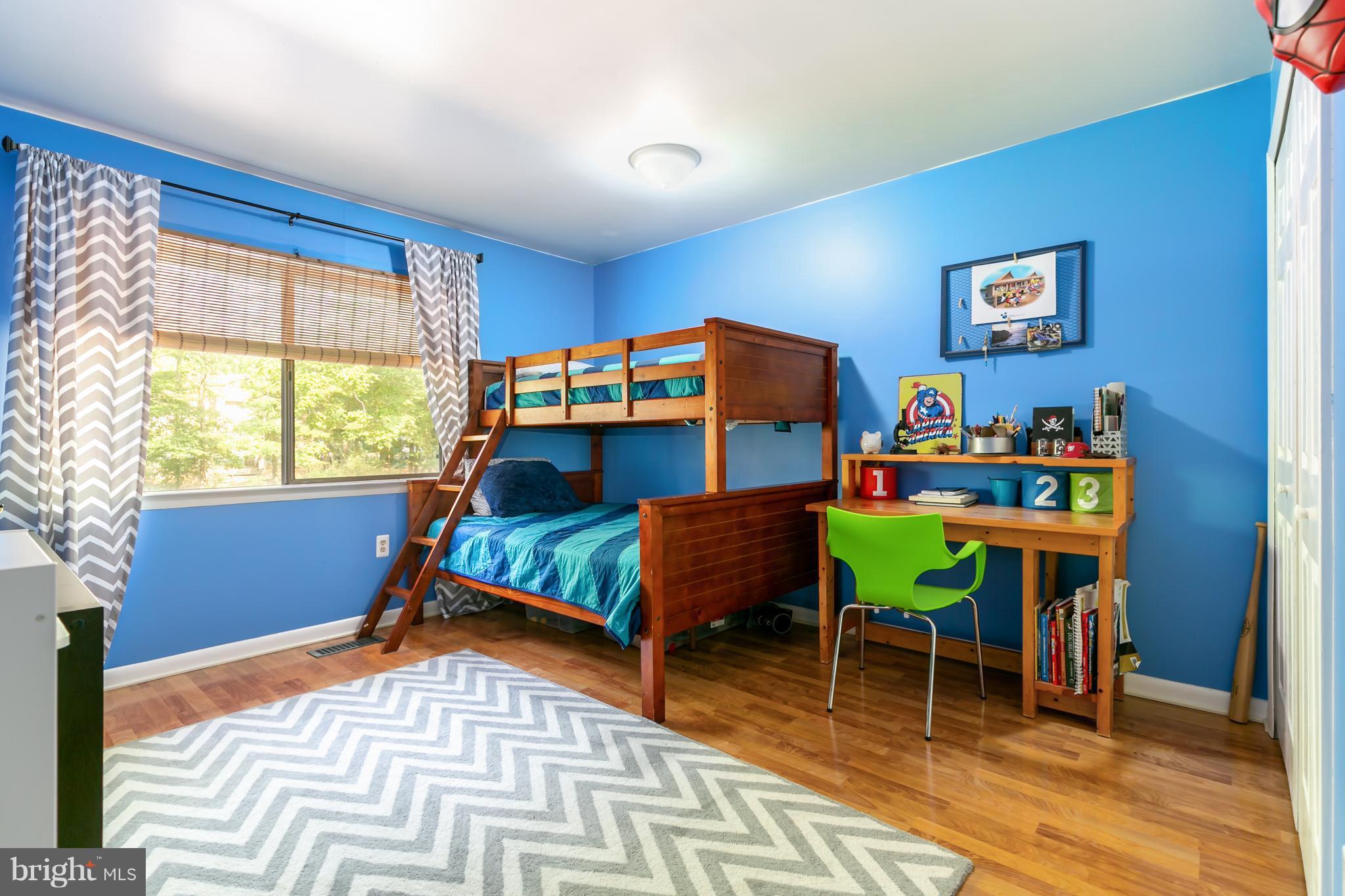 1960 Winterport Cluster Reston, VA 20191 - Photo 15 of 29 a bedroom with a bed and a table in it