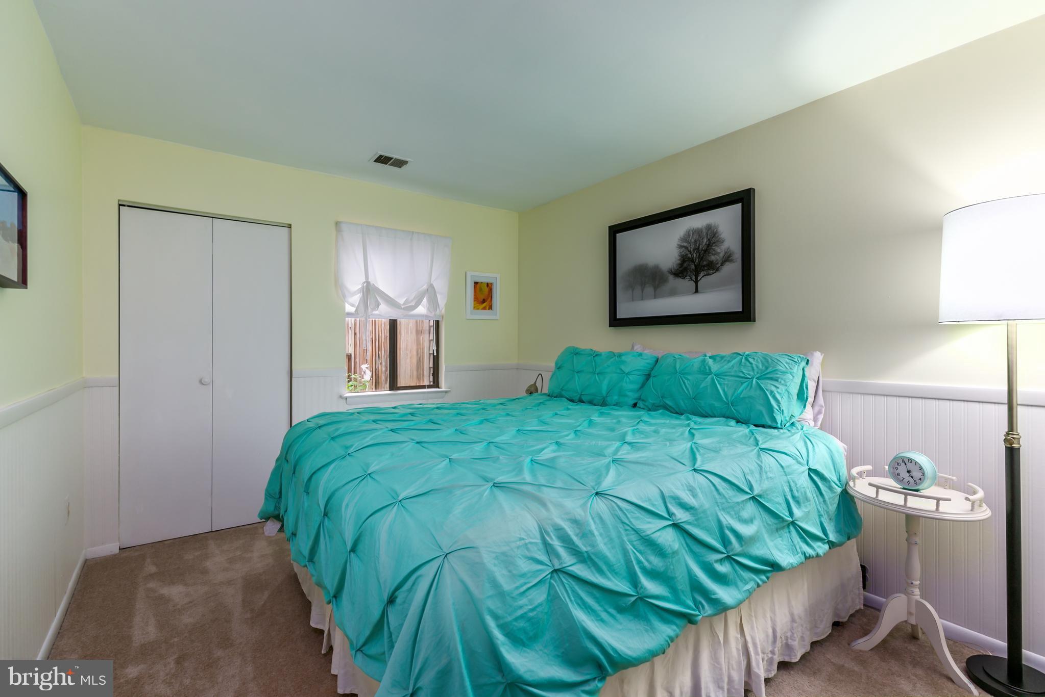 1960 Winterport Cluster Reston, VA 20191 - Photo 18 of 29 a large bed sitting in a bedroom and table