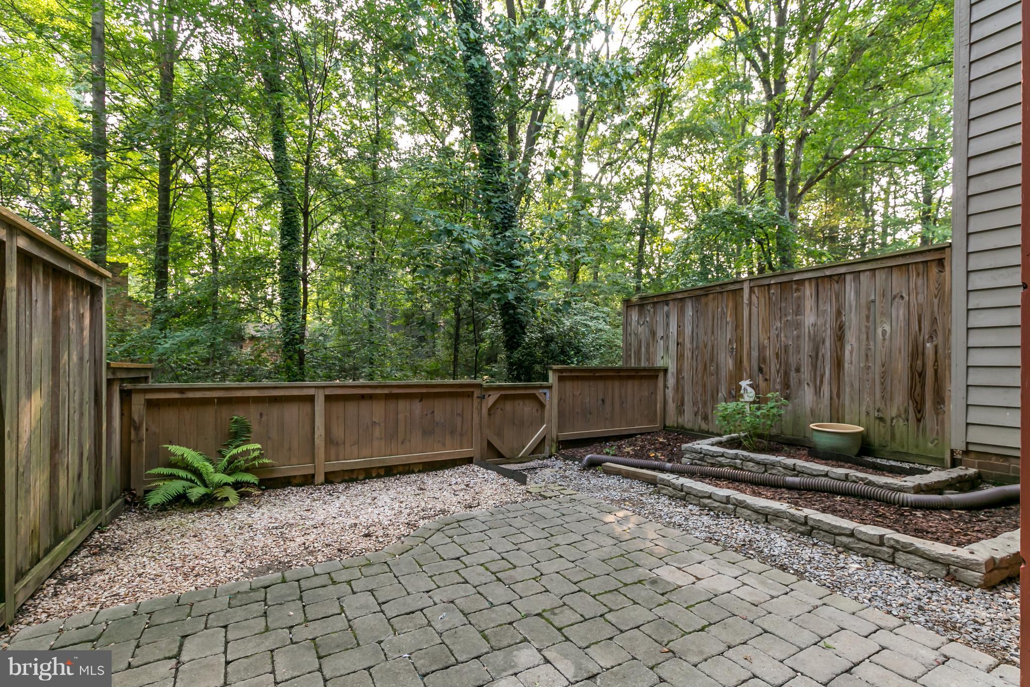 1960 Winterport Cluster Reston, VA 20191 - Photo 23 of 29 a view of a backyard with plants and large trees