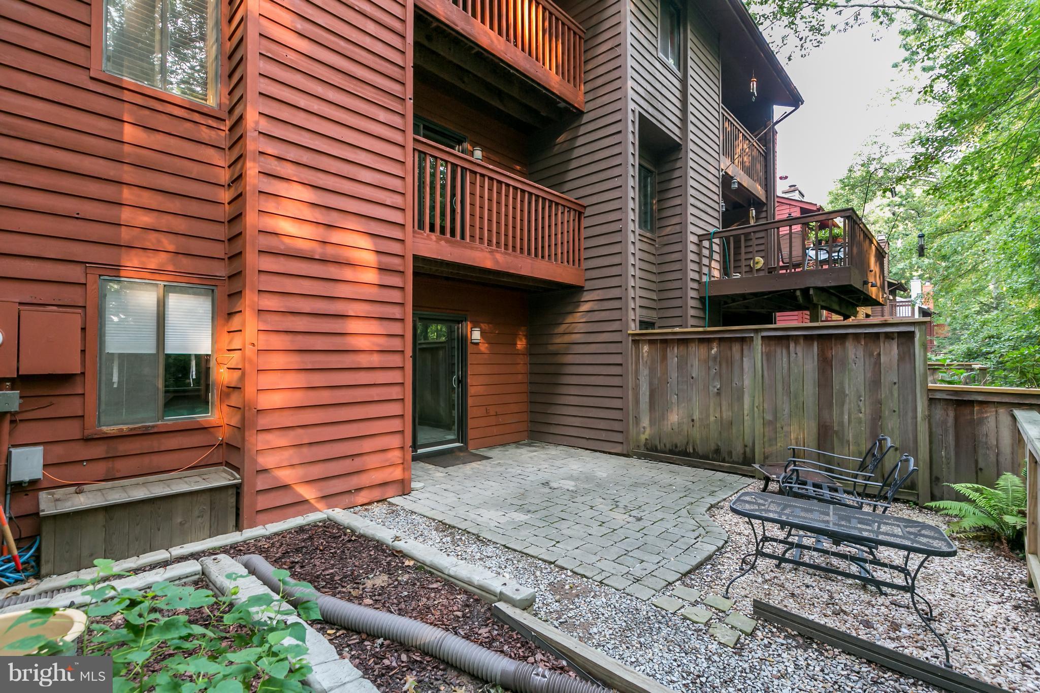 1960 Winterport Cluster Reston, VA 20191 - Photo 25 of 29 a view of a house with a small deck and a wooden fence