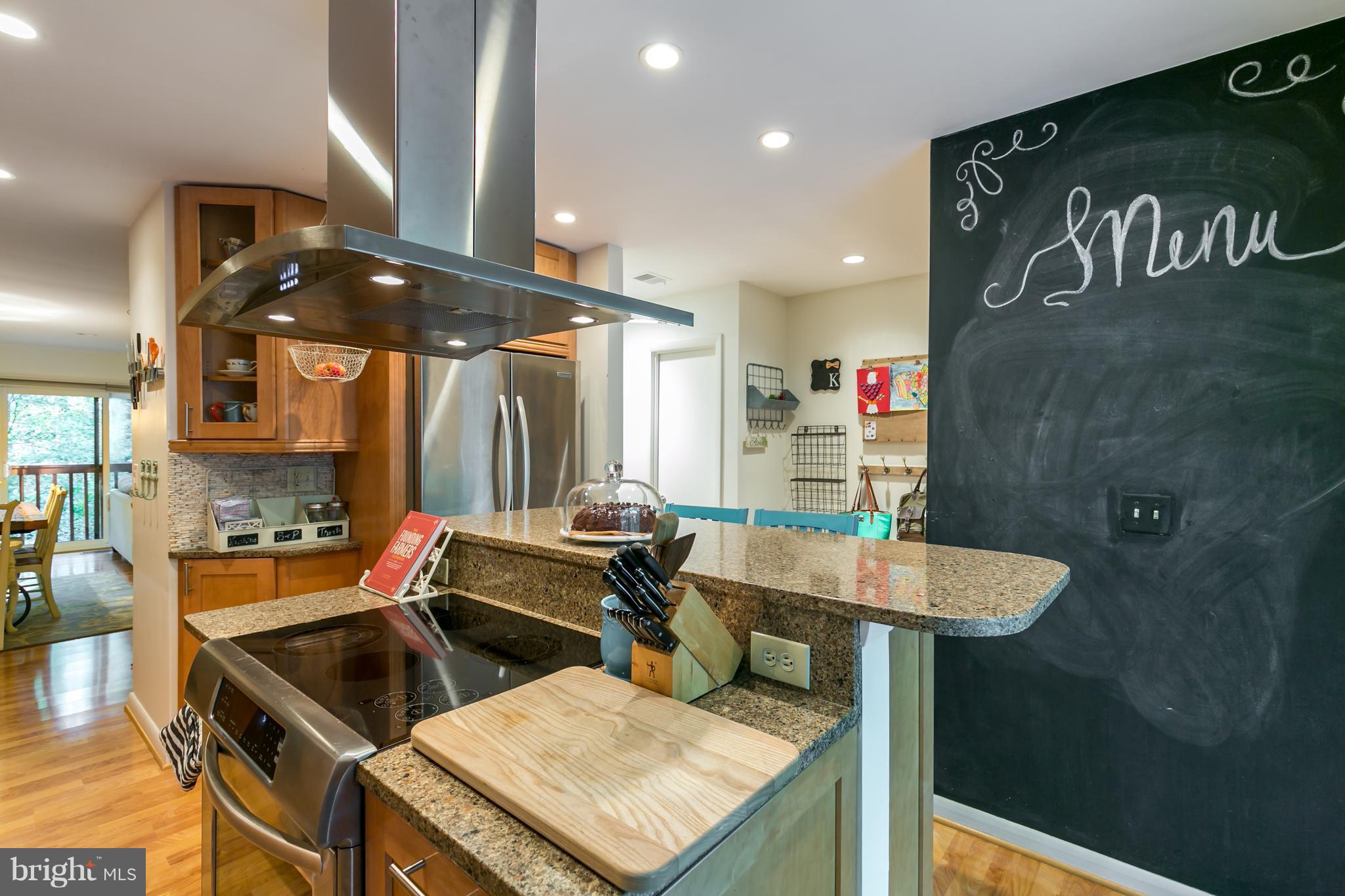 1960 Winterport Cluster Reston, VA 20191 - Photo 4 of 29 a kitchen with a sink a stove and a refrigerator