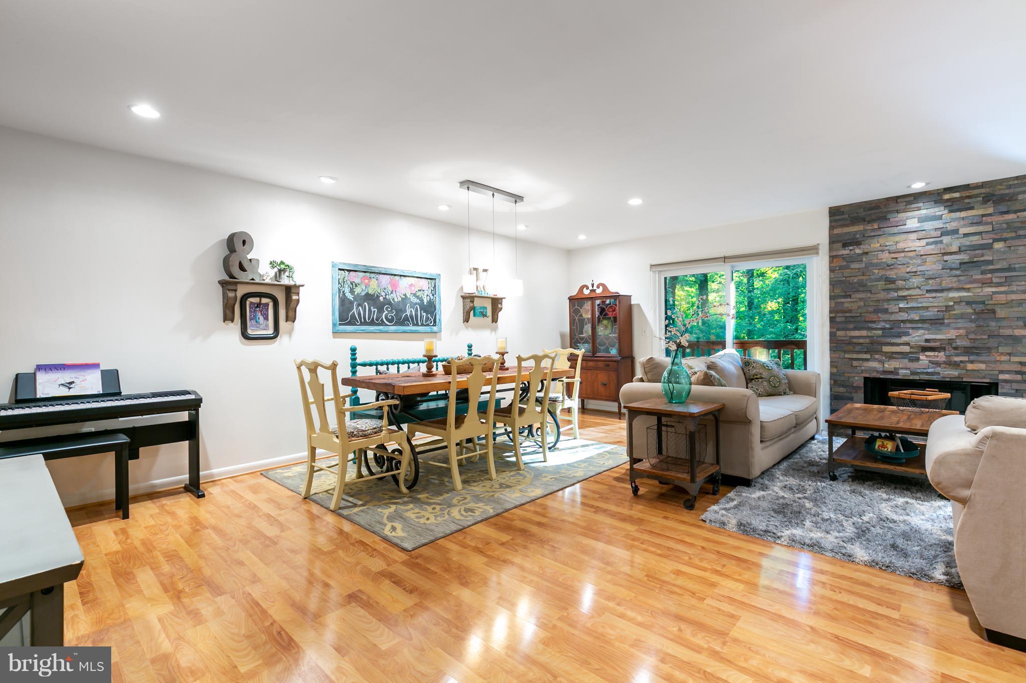 1960 Winterport Cluster Reston, VA 20191 - Photo 7 of 29 a living room with furniture and a dining table with kitchen view