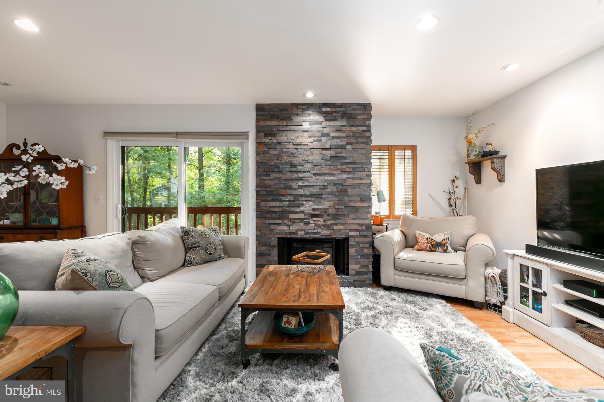 1960 Winterport Cluster Reston, VA 20191 - Photo 9 of 29 a living room with furniture and a flat screen tv