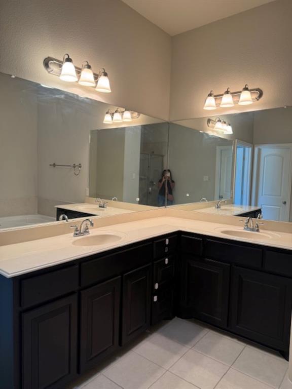 4119 Nia Drive Irving, TX 75038 - Photo 14 of 15 Bathroom with light tile patterned floors and double vanity