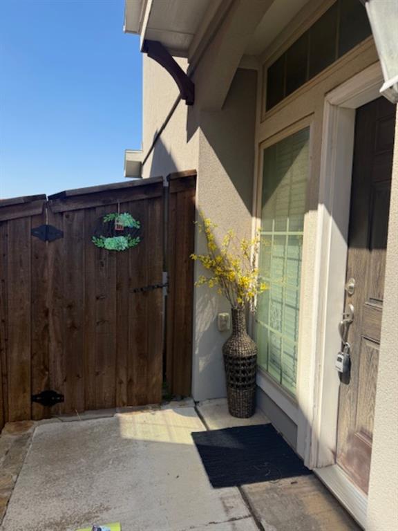 4119 Nia Drive Irving, TX 75038 - Photo 2 of 15 View of exterior entry with a patio area and stucco siding