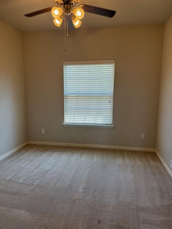 4119 Nia Drive Irving, TX 75038 - Photo 7 of 15 Empty room featuring ceiling fan and light carpet